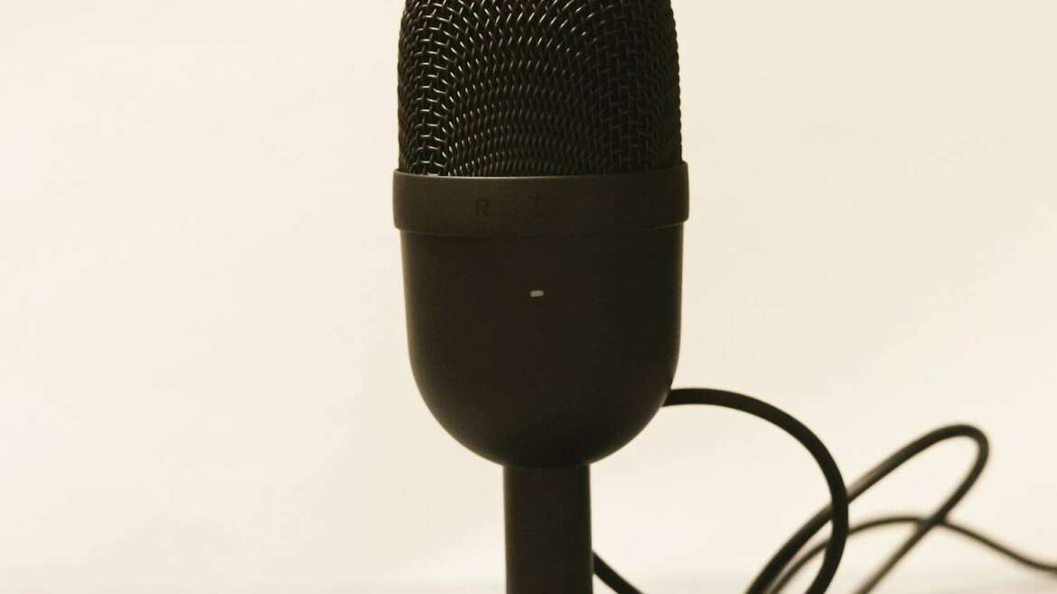 a microphone is plugged into a charger